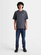 Alpinestars Mandate Oversized CSF, t-shirt de sportswear à manches courtes pour homme, gris anthracite, logo Astars blanc en impression puff sur la poitrine, coupe oversize décontractée, style streetwear.