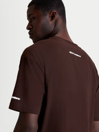 Alpinestars Mandate Oversized CSF T-Shirt, heren-sportswear t-shirt met korte mouwen, bruin met witte puff-print logo graphics op de achterzijde en mouw, oversized pasvorm, zachte katoen-polyester mix.