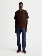 Alpinestars Mandate Oversized CSF T-shirt met korte mouwen voor heren, bruin met een wit puff-print Astars-logo op de borst, oversized pasvorm, katoen-polyester mix, casual sportswear lifestyle kleding.