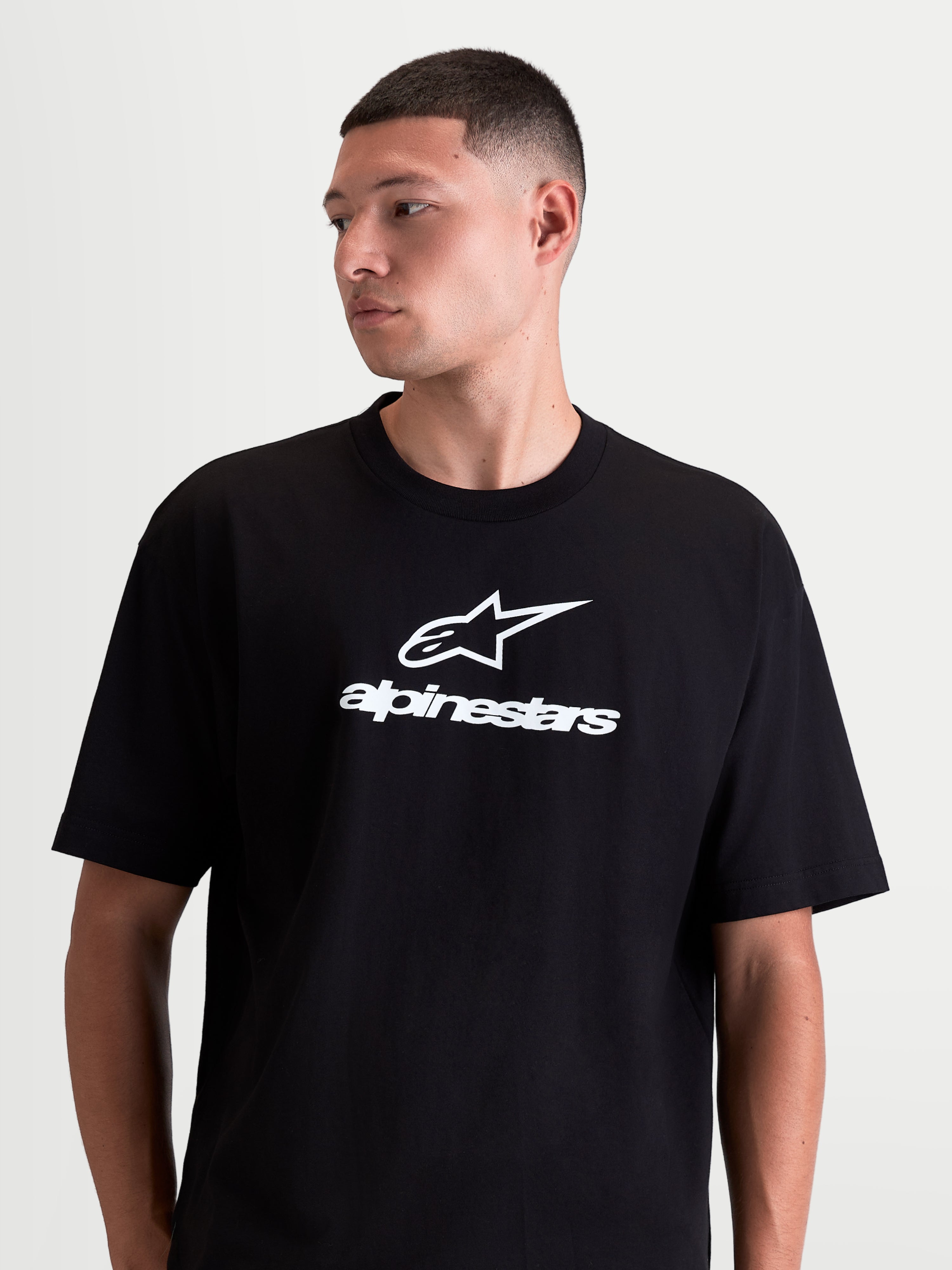 Alpinestars Prelude Oversized CSF Tee, Men's Sportswear Short Sleeve T-Shirt, Black and White, soft cotton-poly blend, featuring front Astars stacked logo and branding in a relaxed, oversized fit.