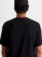 Alpinestars Cypress CSF, t-shirt sportswear à manches courtes, noir, vue de dos sur un modèle, mélange doux de coton et polyester pour un usage quotidien décontracté