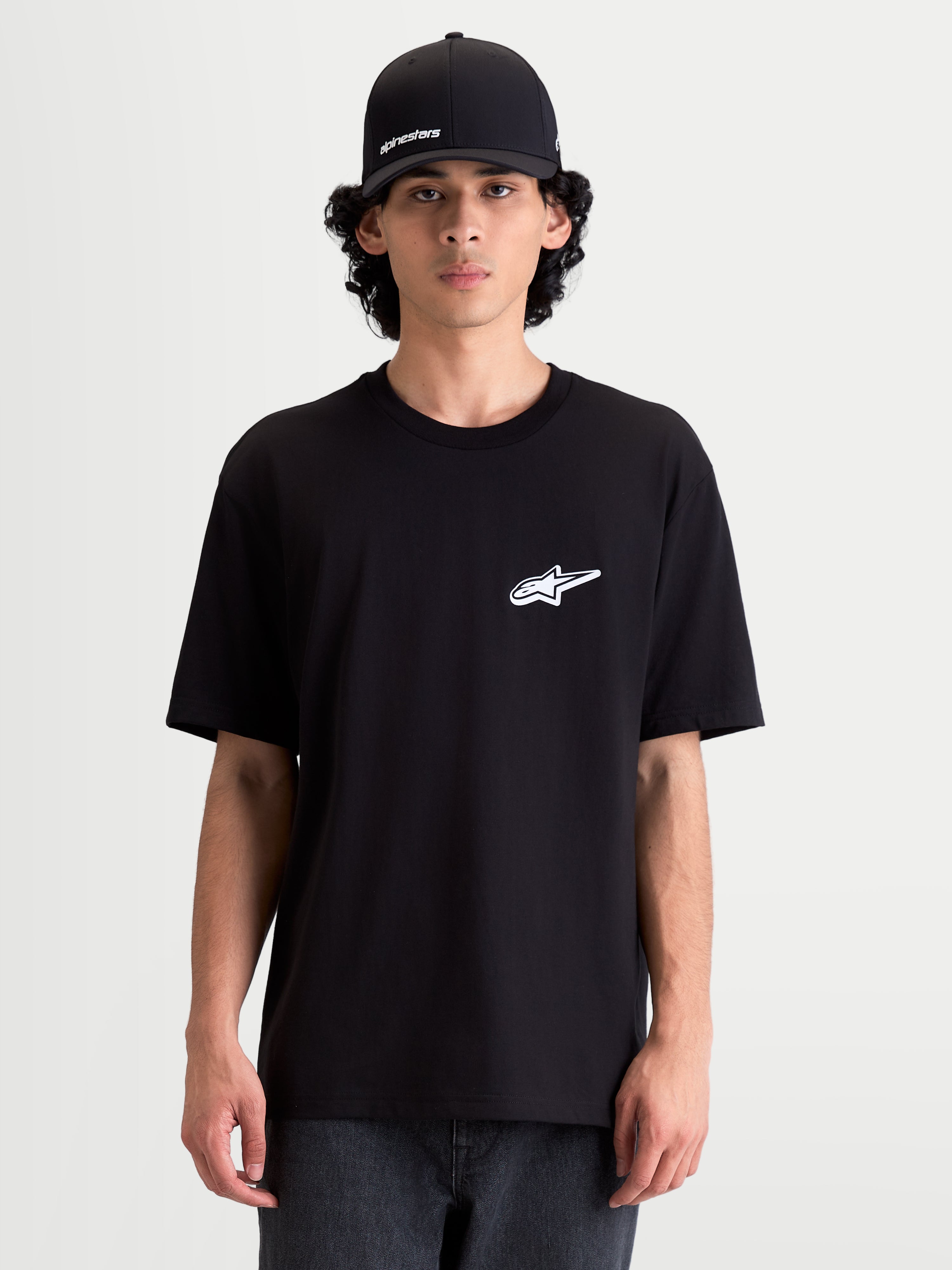 Alpinestars Meteor CSF Tee, Men's Short Sleeve Sportswear T-Shirt, Black with a white Astars chest logo, casual everyday motorsport apparel worn by a model.