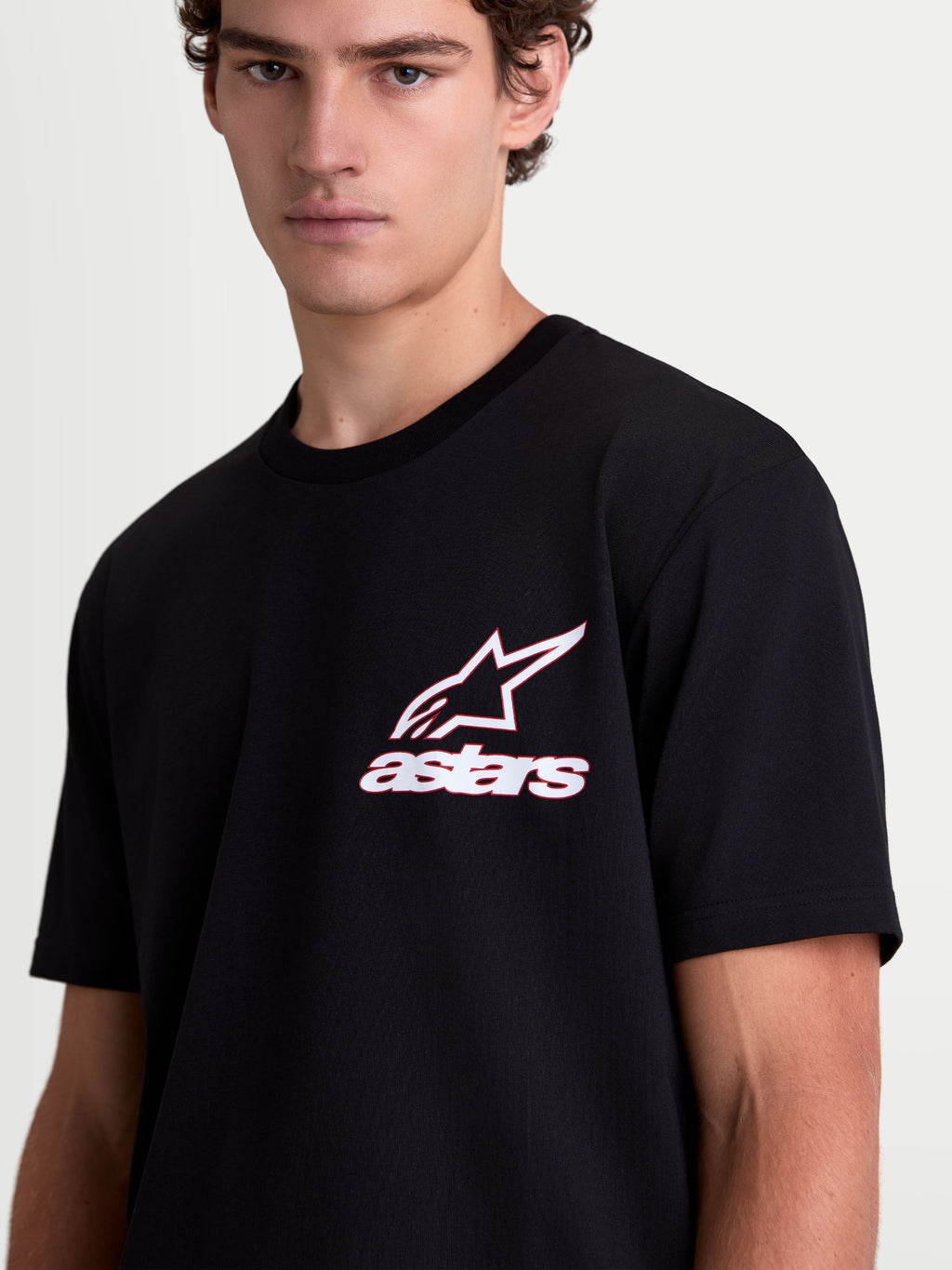 Alpinestars Lineout CSF, t-shirt à manches courtes pour homme, noir avec graphique logo Astars blanc et rouge sur la poitrine, style sportswear décontracté