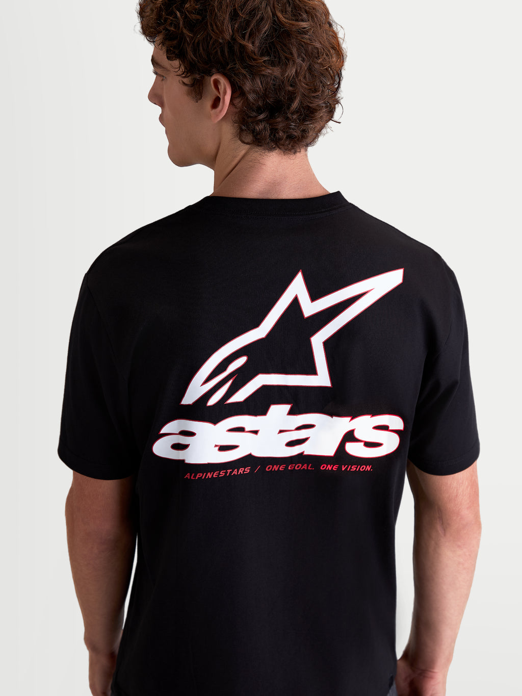 Alpinestars T-Shirt Lineout CSF, t-shirt de sportswear pour homme à manches courtes, noir, vue de dos avec grand logo Astars blanc et rouge et slogan, mélange de coton et polyester pour le confort quotidien.