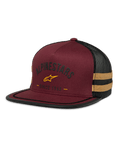 Alpinestars Backline Trucker Hat, kastanienbraune und schwarze Mesh-Kappe, gelbes Stern-Logo und „Since 1963“ Heritage-Grafik, strukturierte Krone mit flachem Schirm, senfgelbe Seitenstreifen