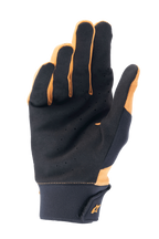 Gants Alpinestars A-Supra, or foncé et noir, vue de la paume montrant le daim synthétique perforé pour la ventilation et l'adhérence, large manchette en néoprène avec fermeture à crochet et boucle et logo doré, gants de cyclisme pour le VTT