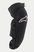 Protection genou/tibia Alpinestars Vector Pro, noir, avec un logo Alpinestars blanc sur le genou, panneau avant texturé résistant à l'abrasion, sangles à scratch réglables, équipement de protection VTT respirant