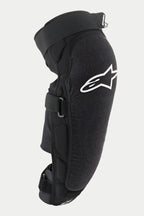 Protection genou/tibia Alpinestars Vector Pro, noir, avec un logo Alpinestars blanc sur le genou, panneau avant texturé résistant à l'abrasion, sangles à scratch réglables, équipement de protection VTT respirant