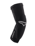 Alpinestars Paragon Plus, genouillères de protection pour VTT, noir et blanc, manchon en maille respirante à enfiler, design ergonomique courbé avec logo étoile blanc, construction rembourrée pour la pratique tout-terrain