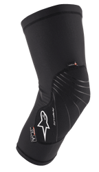 Alpinestars Paragon Lite Knee Protector, noire, équipement de protection léger avec construction en mesh texturé, logo blanc, lignes de design grises, conception à enfiler, avec étiquettes CE Niveau 1 et Polygiene, conçue pour le VTT et le cyclisme tout-terrain