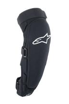 Protections genoux et tibias Alpinestars A-Impact Plasma Pro, noir et blanc, vue latérale avec un grand logo Astar blanc, rembourrage latéral et système de fermeture par sangles sécurisé, protection pour le cyclisme tout-terrain