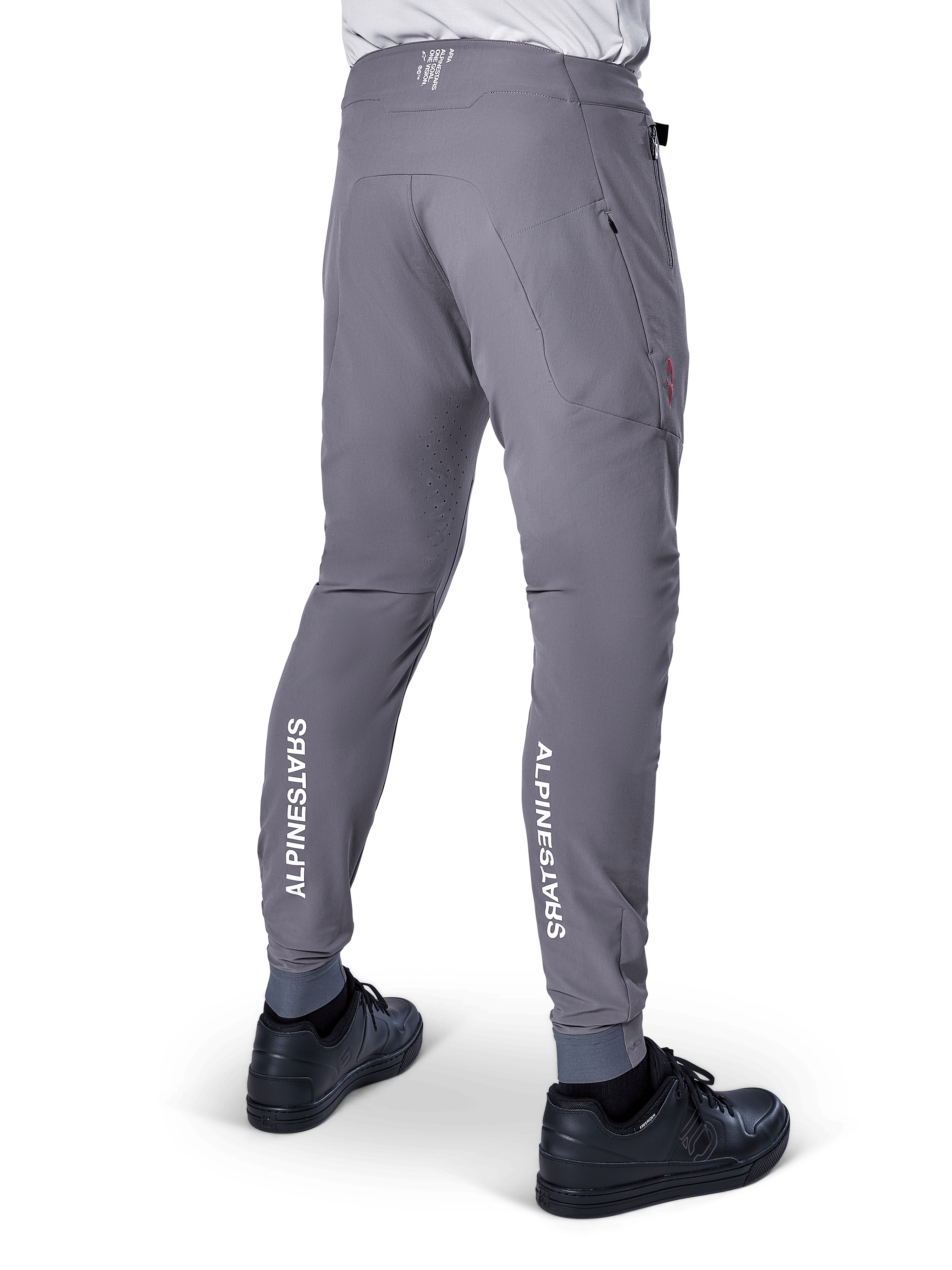 Pantalon Alpinestars A-Aria Elite, pantalon de VTT, gris foncé, avec logos Alpinestars blancs verticaux à l'arrière du bas des jambes, perforations de ventilation découpées au laser, poignets élastiques et coupe performance pour le VTT