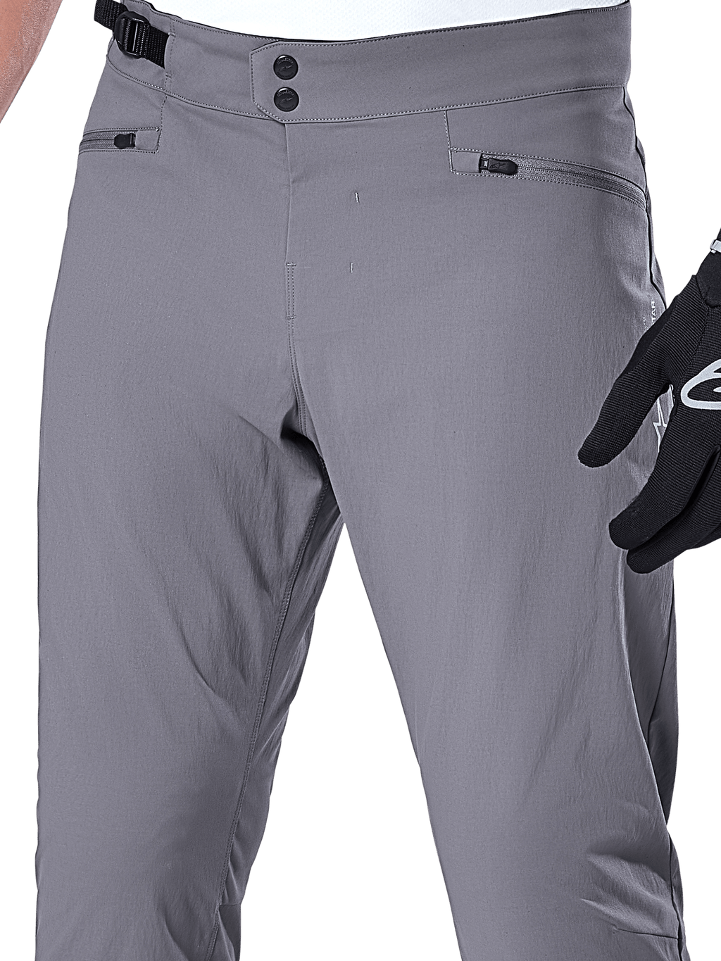 Alpinestars A-Dura Hose, MTB-Hose, Dunkelgrau, Nahaufnahme des Taillenbereichs mit doppeltem Druckknopfverschluss, verstellbarem seitlichem Taillenversteller und Reißverschlusstaschen, strapazierfähiges Stretchmaterial für Mountainbiking