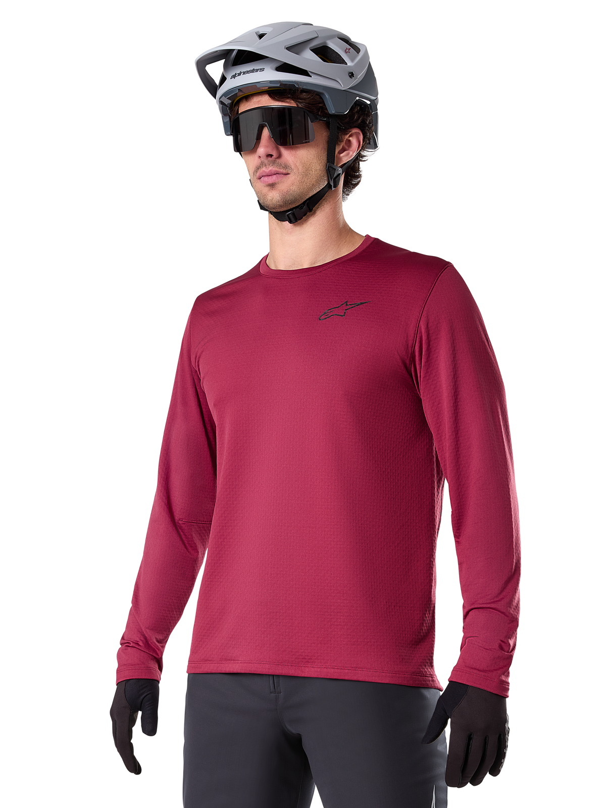 Alpinestars A-Dura Thermal Jersey, Long-Sleeve Mountain Biking Base Layer, Red, Moisture-Wicking Thermal Fabric, Worn with Gray Helmet and Black Gloves