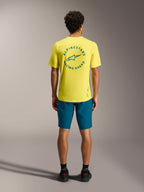 Maillot A-Dura Air SS jaune à logo sarcelle et short A-Dura Ride bleu-vert, équipement de VTT professionnel.