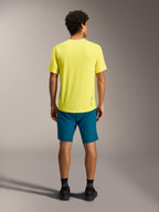 Maillot jaune A-Dura Ride SS et short bleu-vert A-Dura Ride vus de dos, équipement performant pour le VTT.