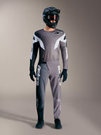 Maillot A-Supra Elite gris dégradé, construction légère et graphismes blancs audacieux pour passionnés de VTT.