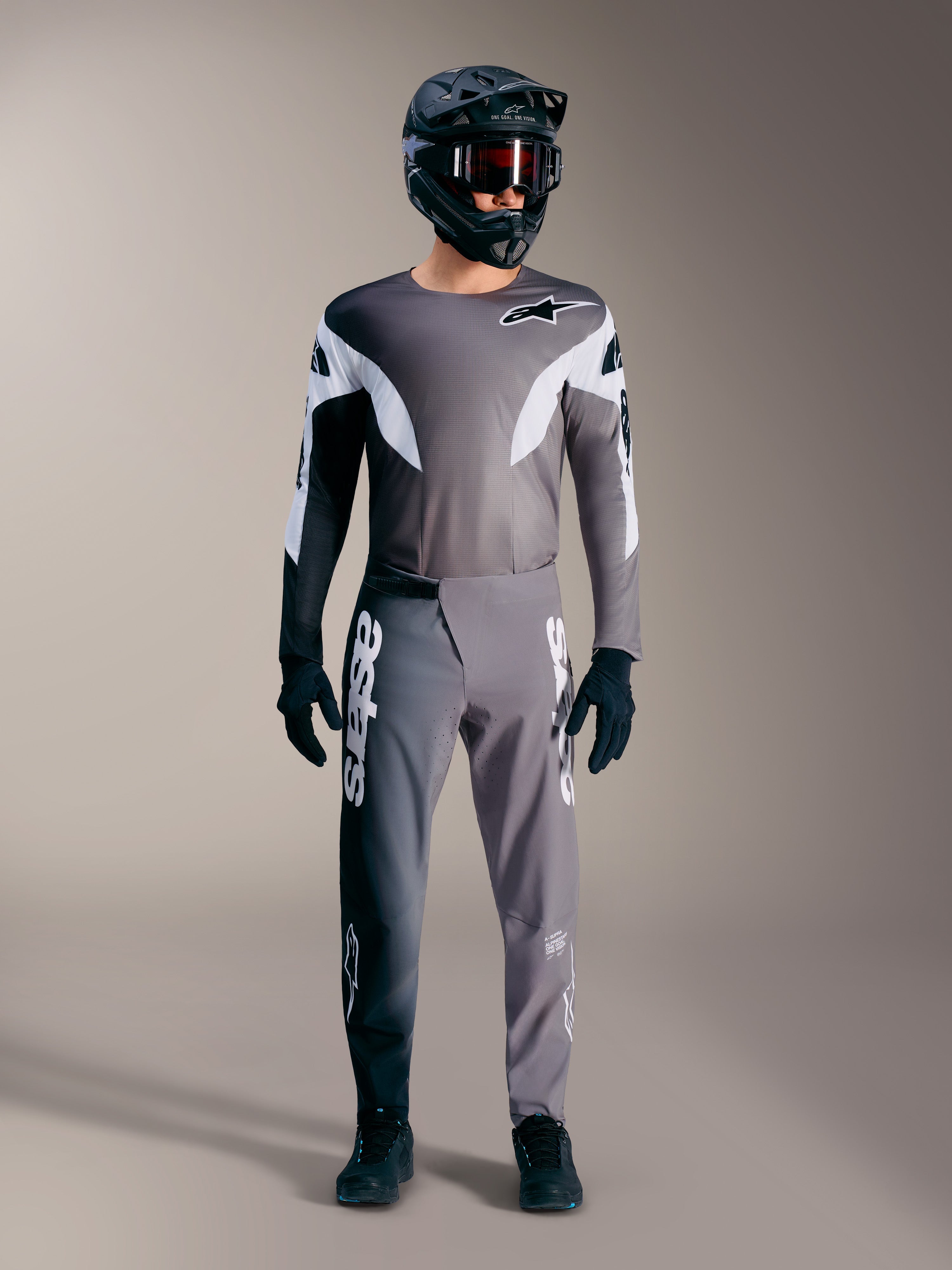 Maillot A-Supra Elite gris dégradé, construction légère et graphismes blancs audacieux pour passionnés de VTT.