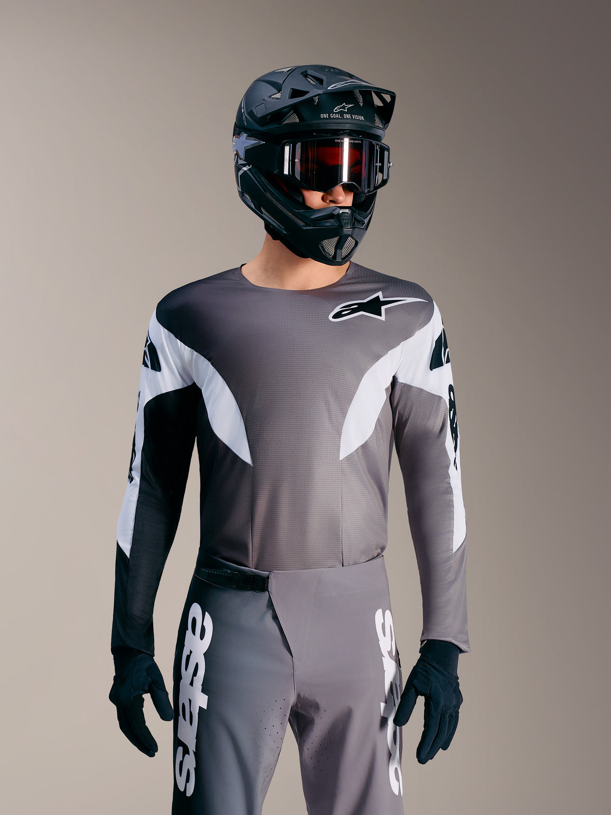 Maillot A-Supra Elite gris dégradé, haut de course VTT micro-perforé avec détails blancs et logo Alpinestars.