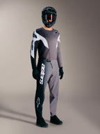 A-Supra Elite MTB-raceuitrusting in Faded Gray, met performance broek, wit Astars woordmerk en bijpassende jersey.