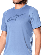 Alpinestars A-Dura Dri Astar Short Sleeve Jersey, Infinity Blue, featuring a dark blue Alpinestars Astar logo on the chest, breathable mesh panels on the sleeves, technical MTB cycling apparel