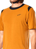 Alpinestars A-Dura Dri Wool Jersey, Short Sleeve Cycling Jersey, Dark Gold, black mesh collar and shoulder panels, small black chest logo, close-up front view
