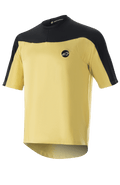 Alpinestars Drop Meta Jersey - korte mouwen, MTB-fietsshirt, goud en zwart, mesh-constructie met kleurvlakken op de schouders, rond logo op de borst en een verlengde achterzoom.