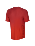 Maillot à manches courtes Alpinestars Youth A-Dura Rise, vue arrière, Spicy Orange, texture en tissu jacquard, petit logo Astars noir sur le côté inférieur, pan arrière allongé pour une protection optimale en VTT.