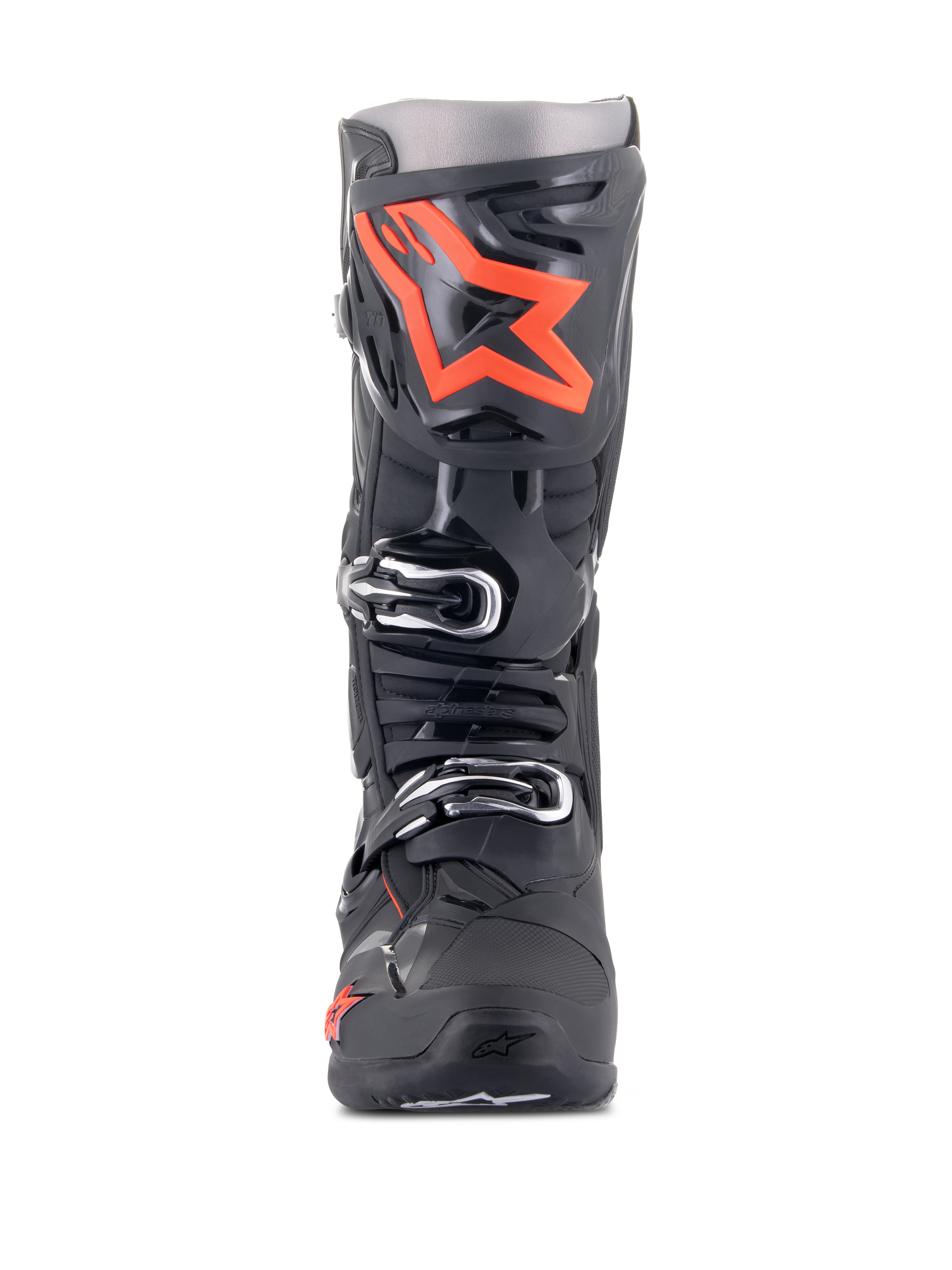 Alpinestars Tech 10 Stiefel, Motocross-Stiefel, Schwarz und Fluo-Rot, Vorderansicht, großes leuchtrotes Stern-Logo auf der Schienbeinplatte, silberne Schnallen, strapazierfähiges schwarzes TPU-Chassis.