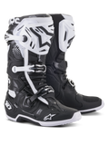 Alpinestars Tech 10 Motocross Boots, Black and White, high-performance protective design with white shin plates, black star logos, adjustable buckles, and DHCP heel protection, rugged textured soles for off-road racing