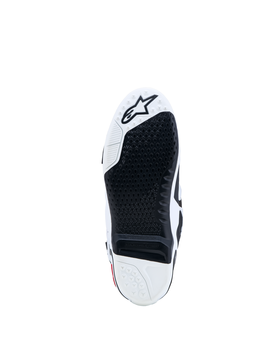 Alpinestars Tech-10 laarzen, motocrosszool in zwart en wit met een vervangbaar grip-inzetstuk en ster-logo.