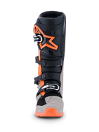Alpinestars 2026 Tech 7 Enduro Boots, Motocross and Enduro Boots, Black Warm Gray and Orange Fluo, front view featuring large orange star logo on the shin, multi-buckle closure system, and rugged protective panels for off-road performance.