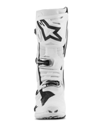 Alpinestars Tech 10 Supervented laarzen, motorcrosslaarzen, wit met zwarte accenten, vooraanzicht met groot zwart Astar-logo op de scheenplaat, gespsluitingssysteem, geperforeerde secties voor ventilatie