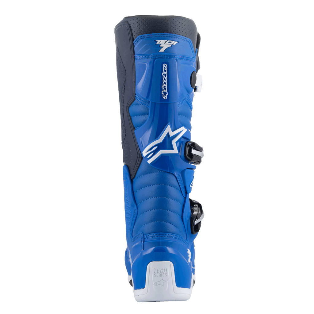 Alpinestars Tech 7 Boots, Motocross Boots, Alpine Blue and Night Navy with White accents, rear view showing the contoured calf protector, white heel reinforcement with Tech Series logo, and side-entry buckle system details.