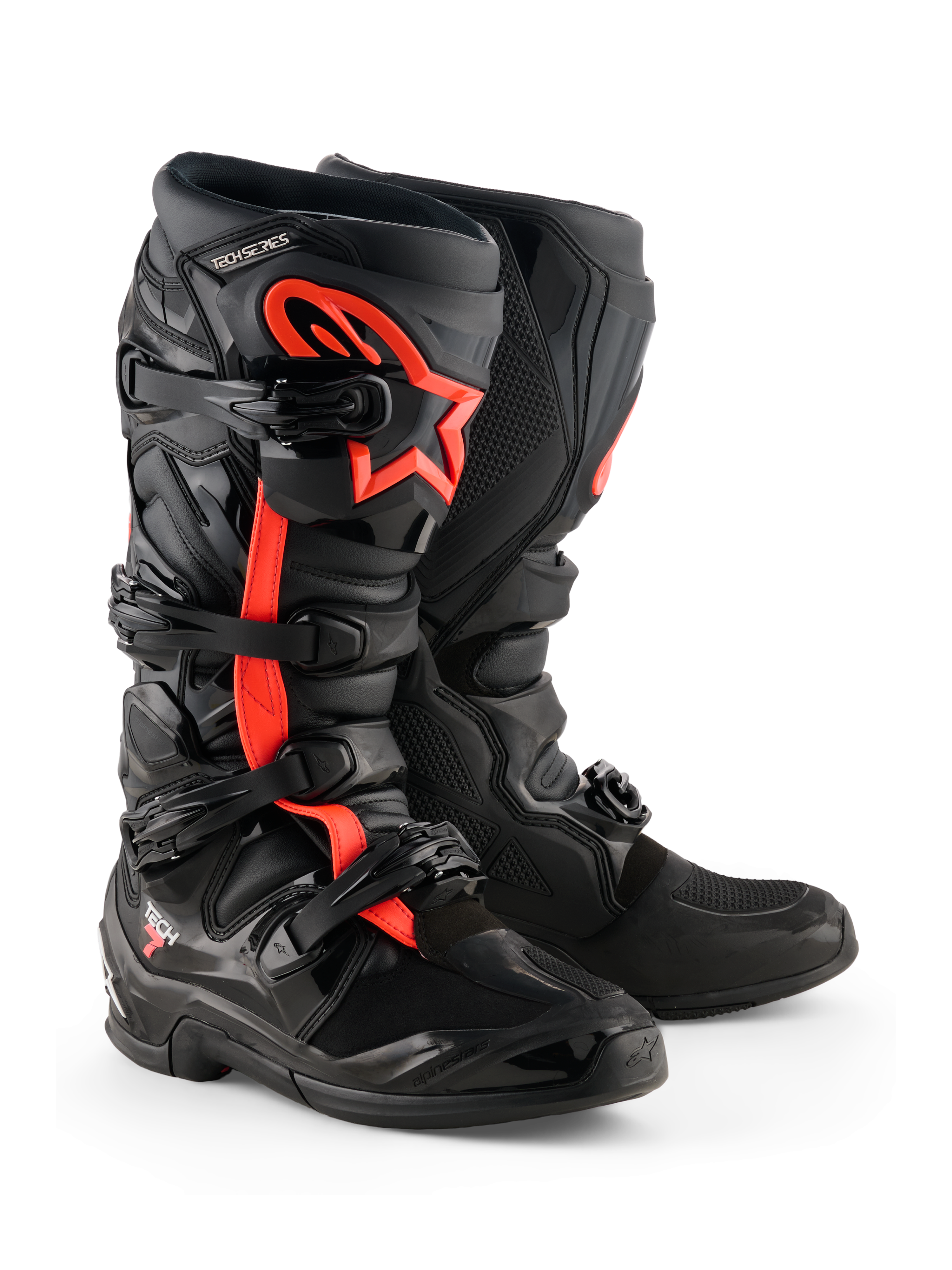 Bottes Alpinestars Tech 7, bottes de motocross, noir et rouge fluo, avec quatre boucles noires, plaque tibiale en TPU et logo étoile Alpinestars rouge sur le côté, design tout-terrain robuste