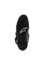 Bottes Alpinestars Tech 7, vue de la semelle en caoutchouc noir, avec logo Astar blanc, motif de semelle texturé et indicateur de limite d'usure rouge pour la performance en motocross