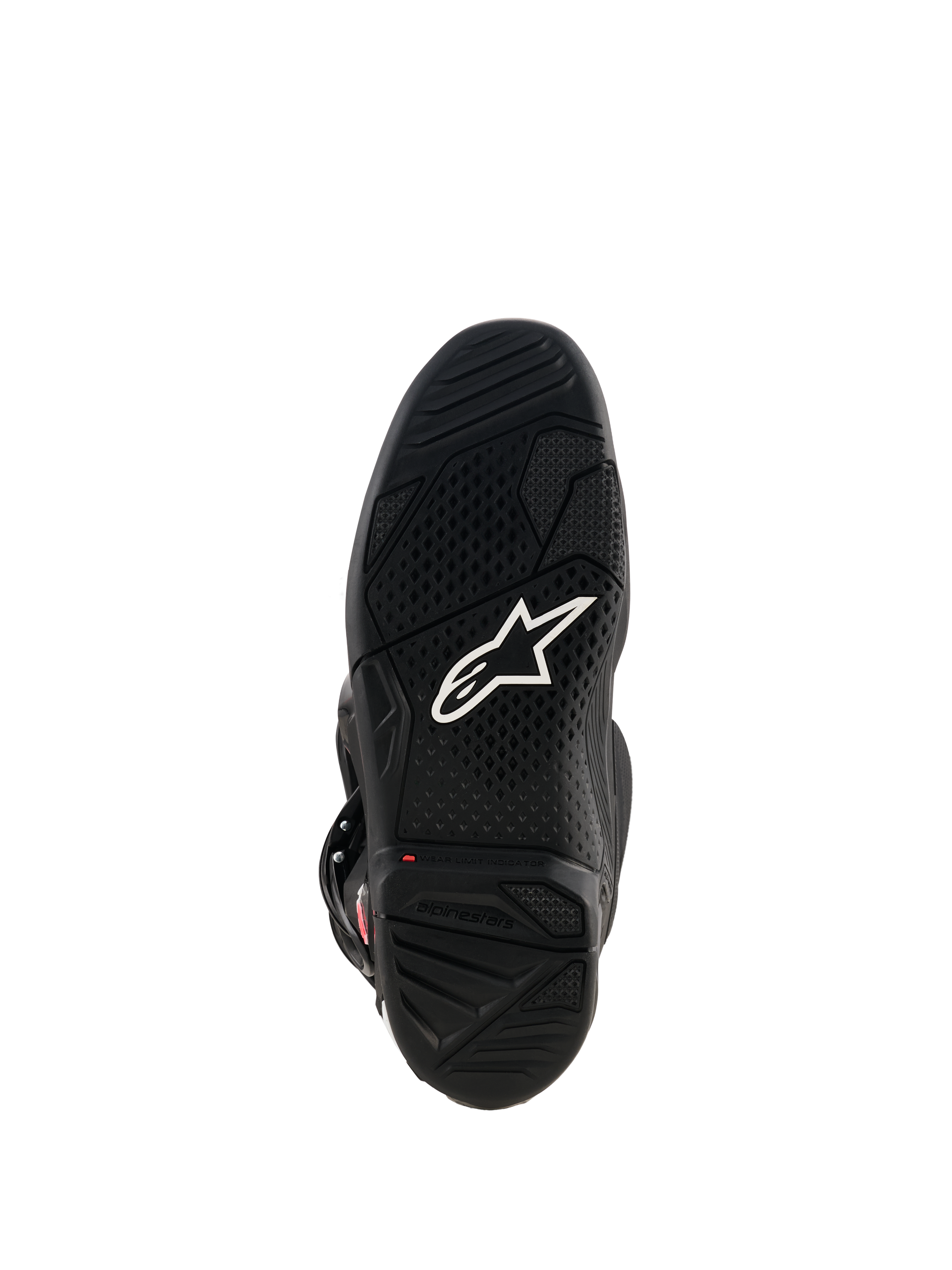 Bottes Alpinestars Tech 7, vue de la semelle en caoutchouc noir, avec logo Astar blanc, motif de semelle texturé et indicateur de limite d'usure rouge pour la performance en motocross