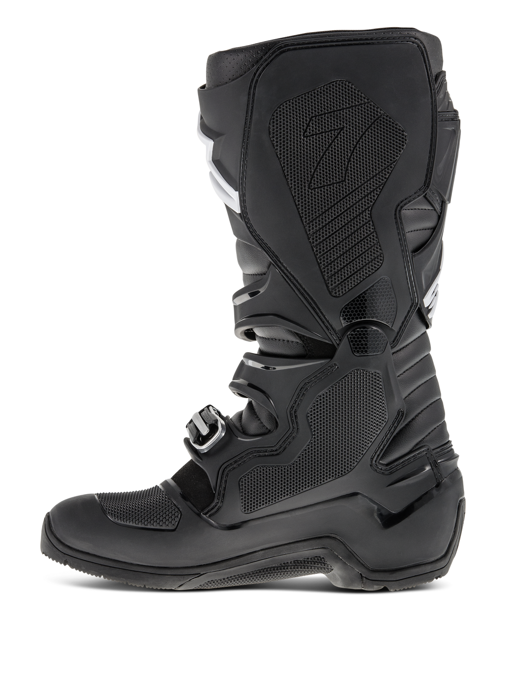 Bottes Alpinestars Tech 7 Enduro, Noir, vue de profil mettant en évidence la face médiale avec insert en caoutchouc alvéolé, panneaux de protection en TPU et système de fermeture à boucles pour la performance motocross tout-terrain