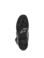 Bottes Alpinestars Tech 7 Enduro, noir, vue de dessous de la semelle, dotées d'un motif de crampons robuste pour l'Enduro, logo étoile blanc et insert de repose-pied remplaçable