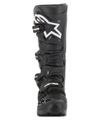 Bottes Alpinestars Tech 7 Enduro Drystar®, bottes de motocross noires, vue de face avec un grand logo étoile blanc sur le tibia, système de fermeture à quatre boucles, construction robuste en TPU pour l'enduro et le tout-terrain