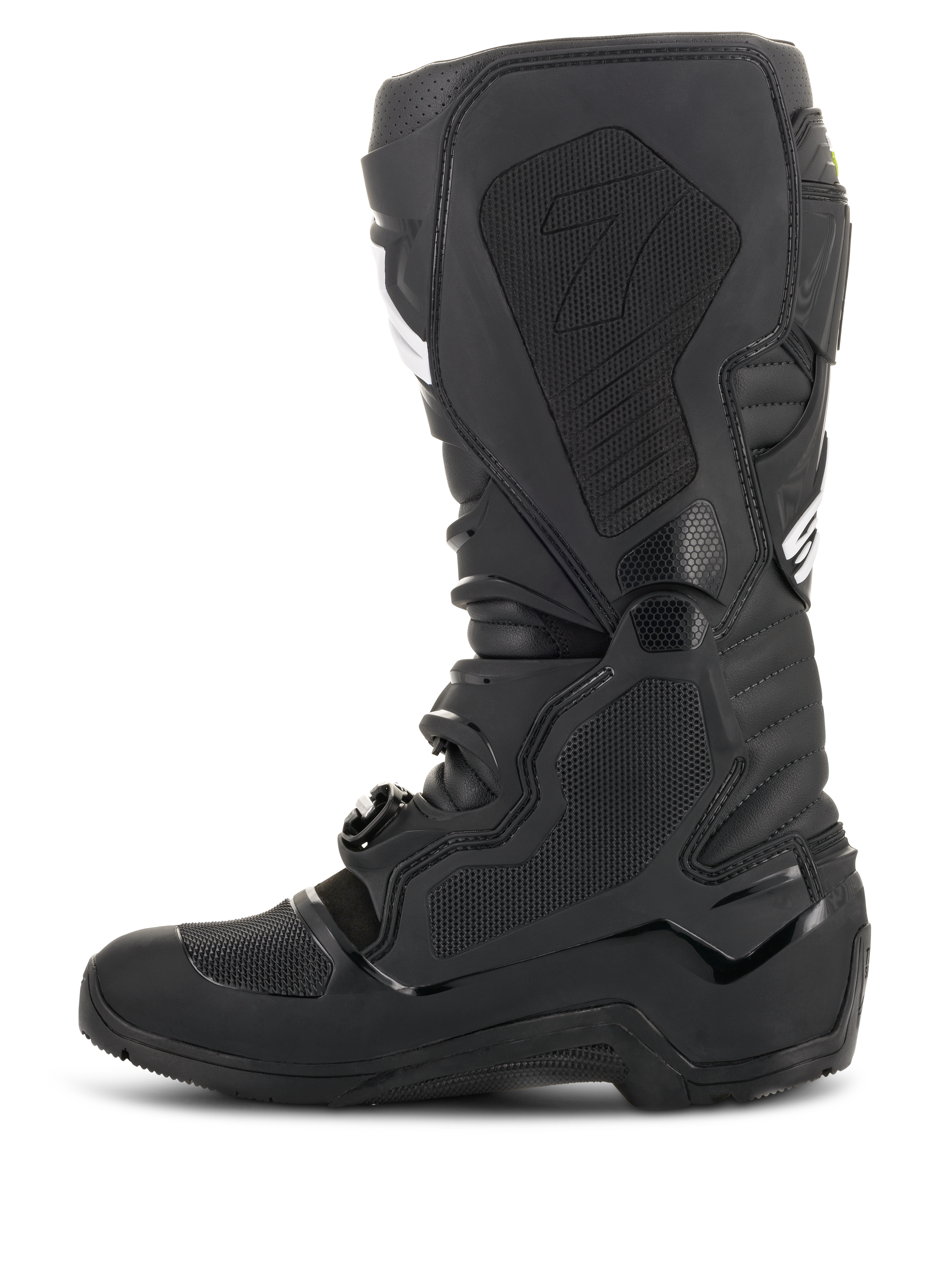 Bottes Alpinestars Tech 7 Enduro Drystar®, noires, vue de profil montrant la zone médiale avec panneaux d'adhérence texturés en nid d'abeille et logo « 7 », chaussures de moto tout-terrain imperméables pour la course d'enduro.