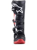 Bottes Alpinestars Honda Tech 7 Enduro Drystar, noir et rouge vif, vue de face montrant le système de fermeture à boucles multiples, grand logo étoile blanc sur le tibia et semelle rouge avec marquage Honda, bottes de moto tout-terrain imperméables