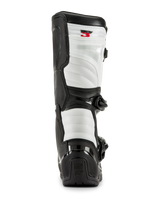 Bottes Alpinestars Tech 3 en noir et blanc, vue arrière montrant des panneaux rembourrés blancs, protection de talon en TPU noir avec logo Tech Series et marquage Tech 3 rouge en haut, chaussures de motocross professionnelles