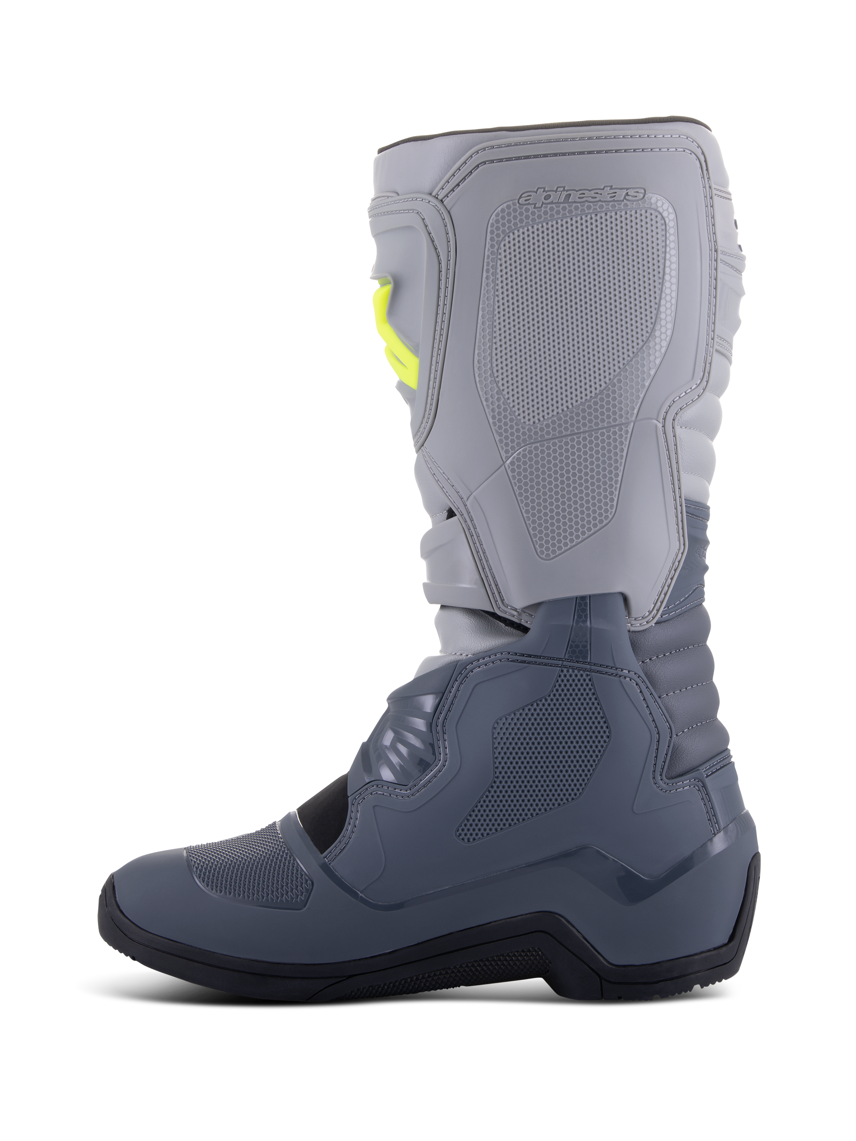 Alpinestars Tech 3 laarzen, motorcrosslaarzen, donkergrijs, lichtgrijs en zwart, zijaanzicht met lichtgrijze bovenkant en donkergrijze onderkant met gele gespaccenten, TPU-beschermingsplaten en een duurzame zwarte zool.