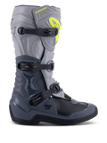 Alpinestars Tech 3 laarzen, motocrosslaarzen, donkergrijs, lichtgrijs en zwart, zijaanzicht met drie zwarte polymeer gespen, TPU-beschermingspanelen en een felgeel Alpinestars-logo op de bovenzijde van het scheenbeen