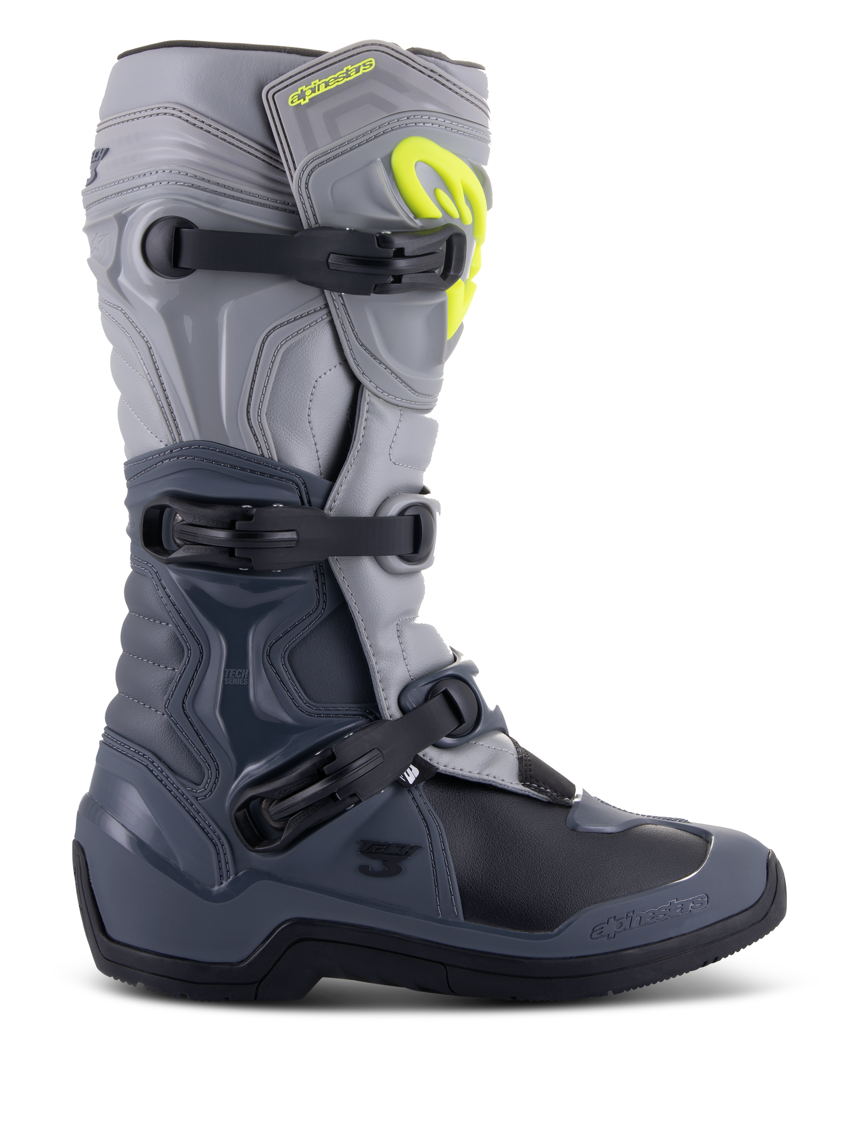 Alpinestars Tech 3 laarzen, motocrosslaarzen, donkergrijs, lichtgrijs en zwart, zijaanzicht met drie zwarte polymeer gespen, TPU-beschermingspanelen en een felgeel Alpinestars-logo op de bovenzijde van het scheenbeen