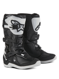 Alpinestars Youth Tech 3S, bottes de motocross pour jeunes pilotes, noires et blanches, dotées de trois boucles de serrage réglables, plaque de tibia en TPU blanc avec logo Alpinestars, protection à coque rigide renforcée et semelle blanche crantée robuste, design pour la course tout-terrain