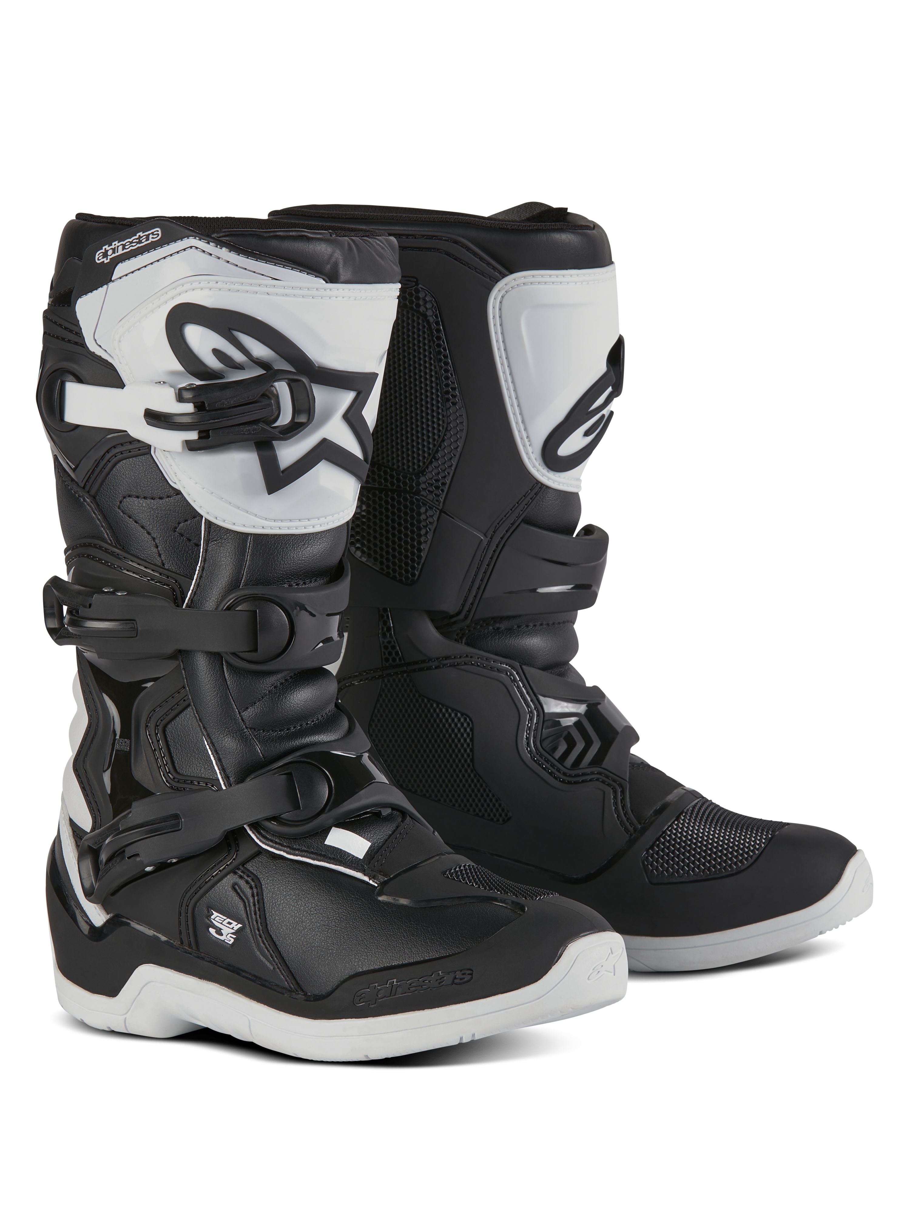 Alpinestars Youth Tech 3S, bottes de motocross pour jeunes pilotes, noires et blanches, dotées de trois boucles de serrage réglables, plaque de tibia en TPU blanc avec logo Alpinestars, protection à coque rigide renforcée et semelle blanche crantée robuste, design pour la course tout-terrain
