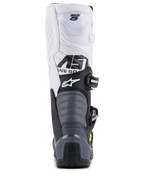 Bottes Alpinestars Tech 5, bottes de motocross, noir, gris foncé et blanc, vue arrière montrant la partie supérieure blanche avec logo Tech 5, zones de flexion en accordéon grises et protection de talon noire avec logo Tech Series