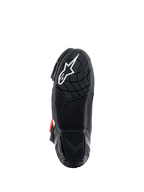 Alpinestars Supertech R Stiefel, Sohlenansicht, schwarze leichte Gummimischung mit texturiertem Profilmuster, weißes Alpinestars-Sternlogo, Hochleistungs-Motorradrennstiefel